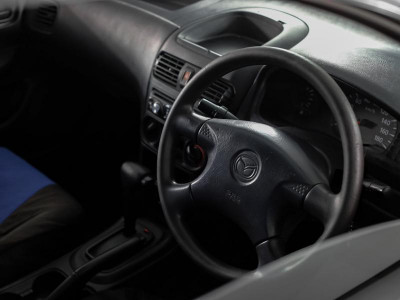 Mazda Familia 1.5 AT (110 л.с.)
